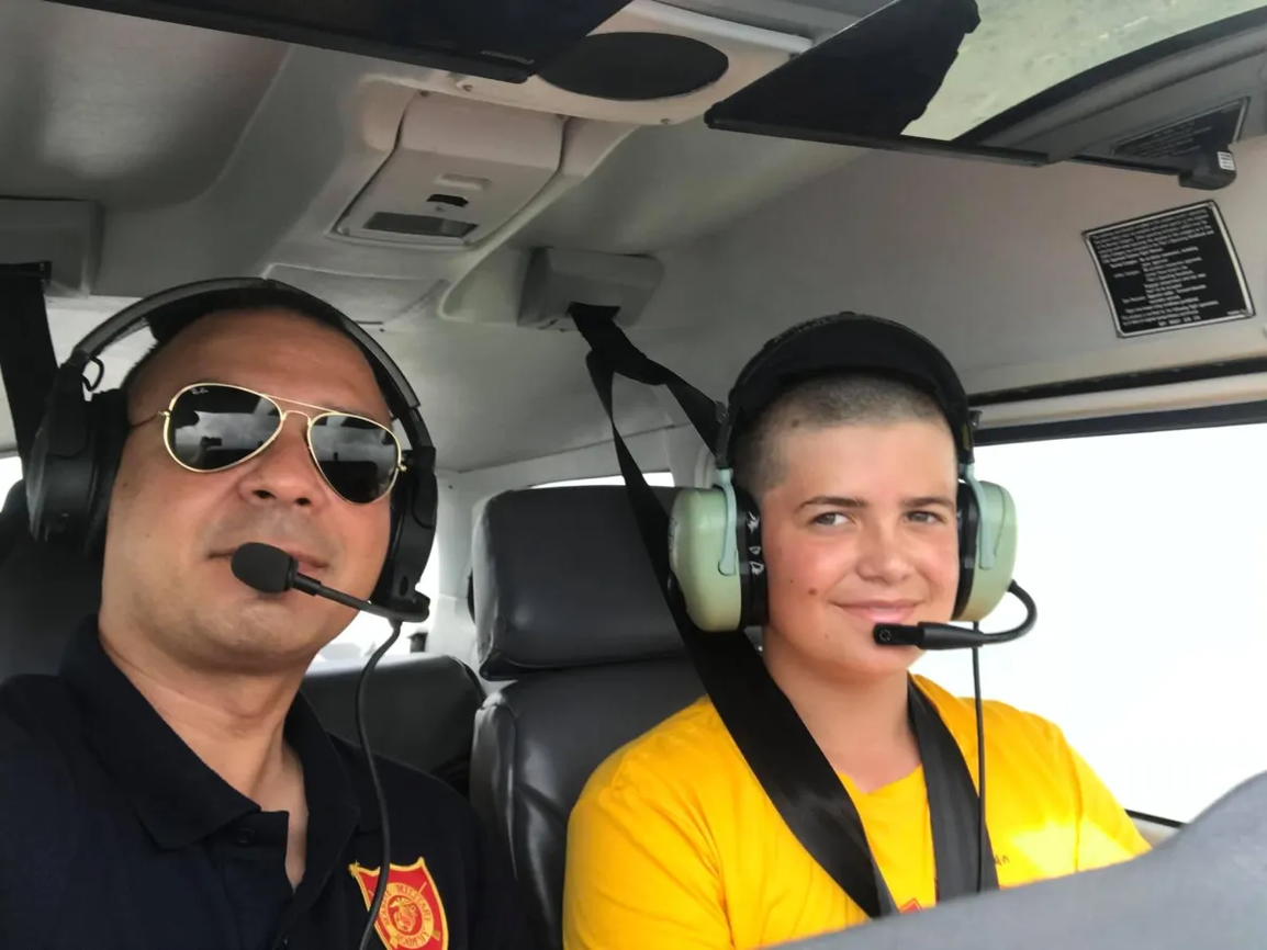 Flight instructor and student pilot beside a training aircraft at Valley Wings Flight School in Harlingen, Texas